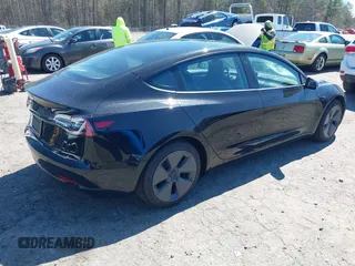 2022 Tesla Model 3 Long Range with VIN 5YJ3E1EB3NF104313, listed as a IAAI auction lot 41832803 with 39,061 mi miles and . Bid and sale history available at DreamBid. Image 4.