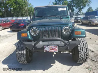 1999 Jeep Wrangler Sahara with VIN 1J4FY49S6XP478675, listed as a Copart auction lot 52147605 with 157,971 mi miles and Salvage Title. Bid and sale history available at carsss.com. Image 5.