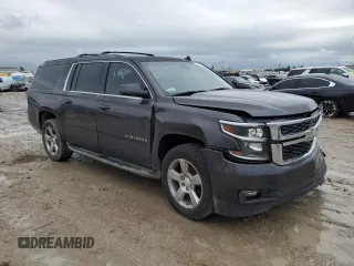 2015 Chevrolet Suburban LT with VIN 1GNSCJKC1FR159411, listed as a Copart auction lot 52169465 with 145,511 mi miles and Salvage title. Bid and sale history available at DreamBid. Image 4.