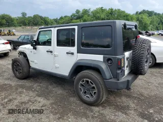 2014 Jeep Wrangler Unlimited Rubicon with VIN 1C4HJWFG4EL114743, listed as a Copart auction lot 61397575 with 110,222 mi miles and Salvage title. Bid and sale history available at DreamBid. Image 2.
