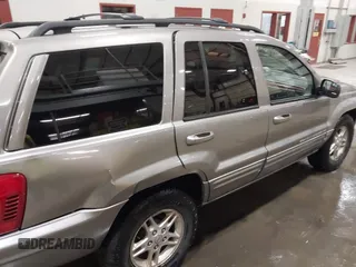 1999 Jeep Grand Cherokee Limited with VIN 1J4GW68N7XC752314, listed as a IAAI auction lot 41776905 with 228,023 mi miles. Bid and sale history available at carsss.com. Image 6.