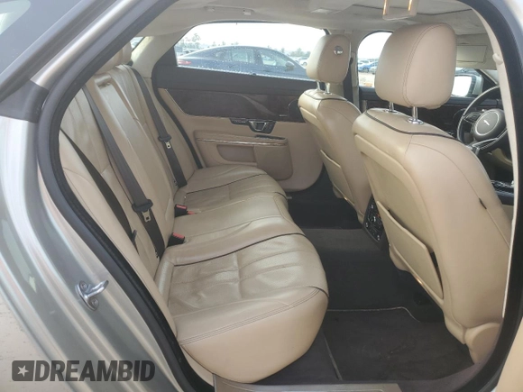 2014 Jaguar XJ with VIN SAJWA2GZ8E8V60138, listed as a Copart auction lot 86384064 with 137,190 mi miles and Salvage Title. Bid and sale history available at carsss.com. Image 10.