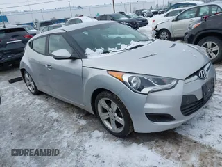 2015 Hyundai Veloster z VIN KMHTC6AD4FU236883, wystawiony jako IAAI lot #41530831 z przebiegiem 103 371 mil mil oraz . Historia ofert i sprzedaży dostępna na DreamBid. Obrazek 1.