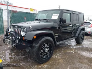 2011 Jeep Wrangler Unlimited Sahara with VIN 1J4BA5H12BL548870, listed as a IAAI auction lot 42010303 with 139,693 mi miles. Bid and sale history available at carsss.com. Image 2.