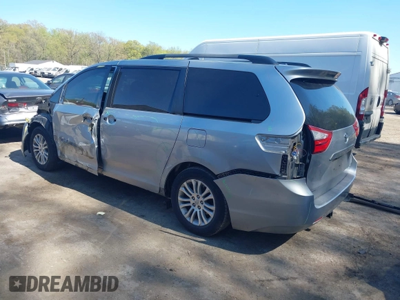 2015 Toyota Sienna XLE with VIN 5TDYK3DC0FS558486, listed as a IAAI auction lot 42064281 with 211,119 mi miles and . Bid and sale history available at DreamBid. Image 3.
