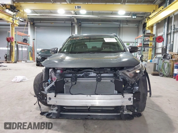 2023 Toyota RAV4 Hybrid XLE with VIN JTMRWRFV7PD206853, listed as a IAAI auction lot 41708570 with 24,157 mi miles. Bid and sale history available at carsss.com. Image 13.