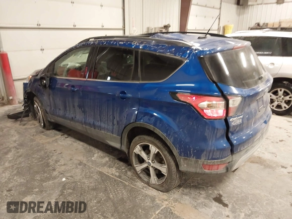 2017 Ford Escape SE z VIN 1FMCU9GD2HUB99955, wystawiony jako IAAI lot #41572200 z przebiegiem 63 023 mil mil oraz . Historia ofert i sprzedaży dostępna na DreamBid. Obrazek 3.