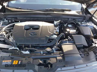 2025 Mazda CX-50 S Premium z VIN 7MMVABDMXSN330164, wystawiony jako IAAI lot #42257895 z przebiegiem Nie podano mil oraz . Historia ofert i sprzedaży dostępna na DreamBid. Obrazek 10.