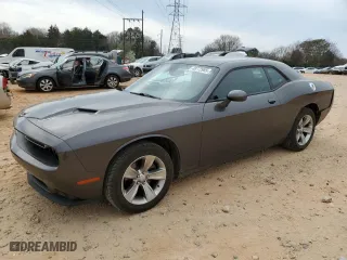 2021 Dodge Challenger SXT with VIN 2C3CDZAG0MH526491, listed as a Copart auction lot 48772985 with 84,300 mi miles and Salvage Title. Bid and sale history available at carsss.com. Image 1.