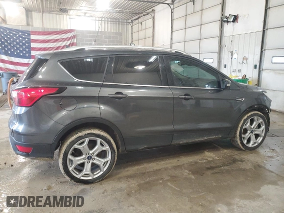 2019 Ford Escape Titanium with VIN 1FMCU0J91KUC02268, listed as a Copart auction lot 54150445 with 165,897 mi miles and Salvage title. Bid and sale history available at DreamBid. Image 3.