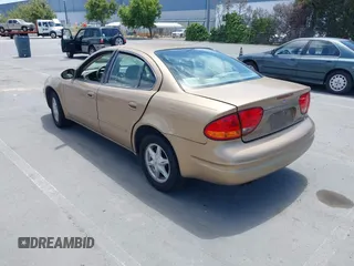 1999 Oldsmobile Alero GL z VIN 1G3NL52T1XC384073, wystawiony jako IAAI lot #42359330 z przebiegiem 177 869 mil mil oraz . Historia ofert i sprzedaży dostępna na DreamBid. Obrazek 3.