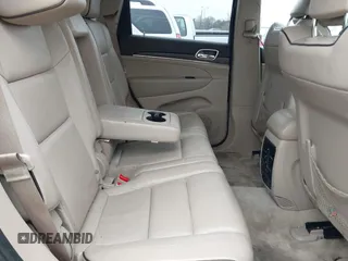 2014 Jeep Grand Cherokee Overland with VIN 1C4RJECG5EC207211, listed as a IAAI auction lot 41586309 with 115,293 mi miles. Bid and sale history available at carsss.com. Image 8.