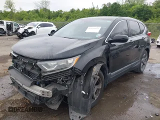 2017 Honda CR-V EX with VIN 7FARW1H59HE007171, listed as a IAAI auction lot 42033941 with 134,227 mi miles and . Bid and sale history available at carsss.com. Image 2.