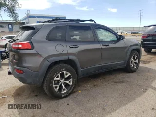 2014 Jeep Cherokee Trailhawk with VIN 1C4PJMBS6EW140981, listed as a Copart auction lot 58260325 with 97,036 mi miles and Salvage title. Bid and sale history available at DreamBid. Image 3.