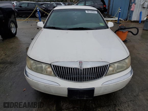 1999 Lincoln Continental with VIN 1LNHM97V3XY667567, listed as a Copart auction lot 84194854 with 137,163 mi miles and Salvage Title. Bid and sale history available at carsss.com. Image 5.