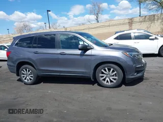 2021 Honda Pilot EX-L with VIN 5FNYF5H57MB046740, listed as a IAAI auction lot 41943366 with 31,198 mi miles and . Bid and sale history available at DreamBid. Image 14.