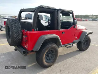2003 Jeep Wrangler SE z VIN 1J4FA29113P323655, wystawiony jako IAAI lot #42704498 z przebiegiem 189 763 mil mil oraz . Historia ofert i sprzedaży dostępna na DreamBid. Obrazek 4.