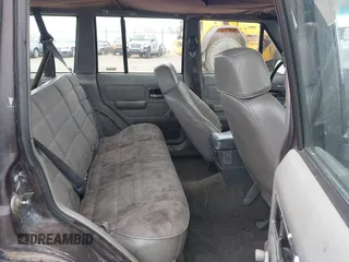 1991 Jeep Cherokee with VIN 1J4FJ88S0ML527479, listed as a IAAI auction lot 42189457 with 321,419 mi miles and . Bid and sale history available at DreamBid. Image 8.