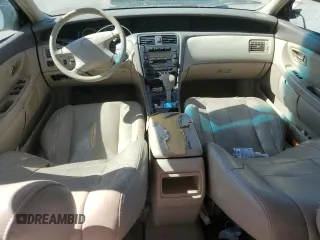2001 Toyota Avalon XL z VIN 4T1BF28B11U154490, wystawiony jako Copart lot #49821065 z przebiegiem 197 805 mil mil oraz Szkoda całkowita • Salvage title. Historia ofert i sprzedaży dostępna na DreamBid. Obrazek 8.