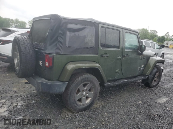2007 Jeep Wrangler Unlimited Sahara с VIN 1J4GA59107L141710, выставлен на аукционе Copart как лот 59939755 с пробегом 212 659 миль миль и Списание • Salvage title. История ставок и продаж доступна на DreamBid. Изображение 3.
