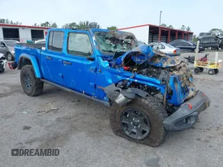 2021 Jeep Gladiator Mojave with VIN 1C6JJTEG1ML621056, listed as a IAAI auction lot 41867530 with 51,739 mi miles and . Bid and sale history available at DreamBid. Image 1.