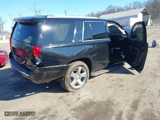 2015 Chevrolet Tahoe LTZ with VIN 1GNSKCKC6FR190314, listed as a IAAI auction lot 41672237 with 176,439 mi miles. Bid and sale history available at carsss.com. Image 4.