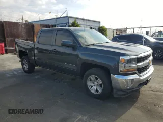 2017 Chevrolet Silverado 1500 LT with VIN 3GCPCREH6HG364570, listed as a Copart auction lot 52647185 with 132,473 mi miles and Salvage Title. Bid and sale history available at DreamBid. Image 4.