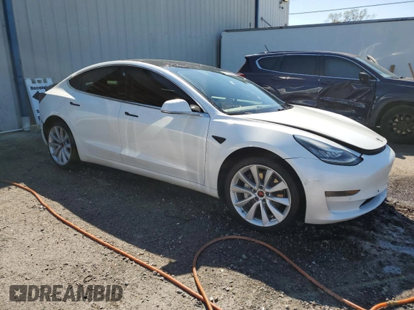 2020 Tesla Model 3 Standard Range Plus with VIN 5YJ3E1EA6LF661513, listed as a Copart auction lot 47008985 with 128,362 mi miles and Non Repairable. Bid and sale history available at DreamBid. Image 4.