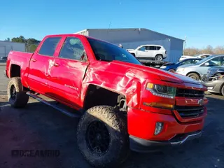 2018 Chevrolet Silverado 1500 LT with VIN 3GCUKREC7JG359913, listed as a IAAI auction lot 41848404 with 125,377 mi miles. Bid and sale history available at carsss.com. Image 1.