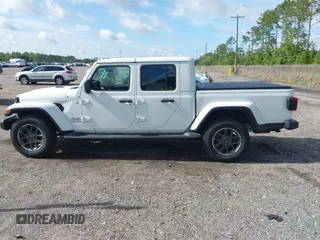 2021 Jeep Gladiator Overland z VIN 1C6HJTFG3ML584038, wystawiony jako IAAI lot #42634959 z przebiegiem 21 843 mil mil oraz . Historia ofert i sprzedaży dostępna na DreamBid. Obrazek 13.