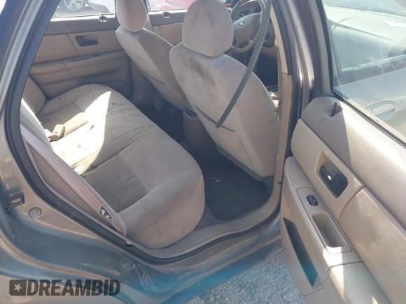 2003 Ford Taurus SE Standard z VIN 1FAFP53UX3A228383, wystawiony jako IAAI lot #42700752 z przebiegiem 182 598 mil mil oraz . Historia ofert i sprzedaży dostępna na DreamBid. Obrazek 8.