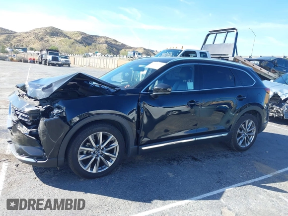 2018 Mazda CX-9 Grand Touring z VIN JM3TCADY8J0221221, wystawiony jako IAAI lot #41644721 z przebiegiem 41 510 mil mil oraz . Historia ofert i sprzedaży dostępna na DreamBid. Obrazek 14.