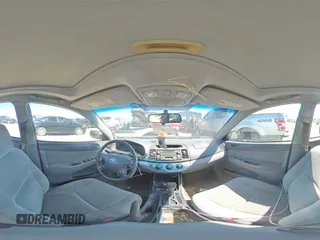 2003 Toyota Camry LE z VIN 4T1BF32K93U566965, wystawiony jako Copart lot #71979144 z przebiegiem 267 228 mil mil oraz Szkoda całkowita • Salvage title. Historia ofert i sprzedaży dostępna na DreamBid. Obrazek 13.