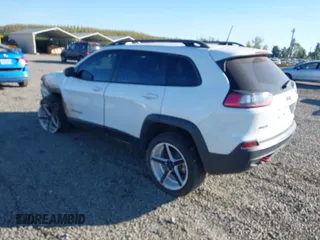 2021 Jeep Cherokee Trailhawk with VIN 1C4PJMBX9MD105888, listed as a IAAI auction lot 42065175 with 55,469 mi miles and . Bid and sale history available at DreamBid. Image 3.