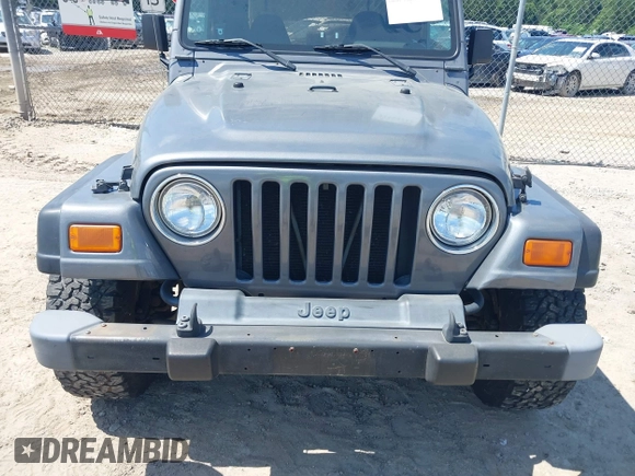 2002 Jeep Wrangler Sport z VIN 1J4FA49S62P731507, wystawiony jako IAAI lot #42584222 z przebiegiem 206 661 mil mil oraz . Historia ofert i sprzedaży dostępna na DreamBid. Obrazek 6.