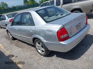 2003 Mazda Protege DX z VIN JM1BJ225430131527, wystawiony jako IAAI lot #42144261 z przebiegiem 215 988 mil mil oraz . Historia ofert i sprzedaży dostępna na DreamBid. Obrazek 3.