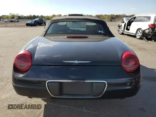 2003 Ford Thunderbird Deluxe z VIN 1FAHP60A63Y104093, wystawiony jako Copart lot #76028744 z przebiegiem 79 995 mil mil oraz Szkoda całkowita • Salvage title. Historia ofert i sprzedaży dostępna na DreamBid. Obrazek 6.