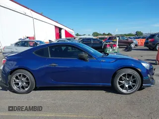 2013 Scion FR-S with VIN JF1ZNAA11D2702415, listed as a IAAI auction lot 40381041 with 63,581 mi miles. Bid and sale history available at carsss.com. Image 13.