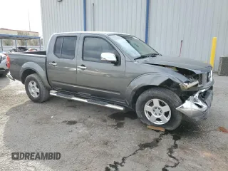 2006 Nissan Frontier SE with VIN 1N6AD07U46C441698, listed as a Copart auction lot 87406004 with 178,760 mi miles and Salvage title. Bid and sale history available at DreamBid. Image 4.