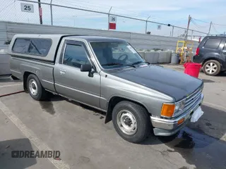 1987 Toyota Pickup with VIN JT4RN50R0H5109089, listed as a IAAI auction lot 41403518 with 165,211 mi miles and . Bid and sale history available at DreamBid. Image 1.