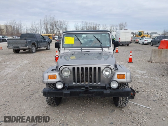 2001 Jeep Wrangler Sport z VIN 1J4FA49S31P349269, wystawiony jako IAAI lot #41427014 z przebiegiem 112 421 mil mil oraz . Historia ofert i sprzedaży dostępna na DreamBid. Obrazek 6.