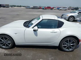 2023 Mazda MX-5 Miata Grand Touring с VIN JM1NDAM71P0560062, выставлен на аукционе IAAI как лот 42065123 с пробегом 11 320 миль миль и . История ставок и продаж доступна на DreamBid. Изображение 14.