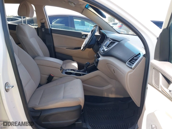 2017 Hyundai Tucson Value with VIN KM8J33A27HU438902, listed as a IAAI auction lot 41835502 with 84,885 mi miles. Bid and sale history available at carsss.com. Image 5.