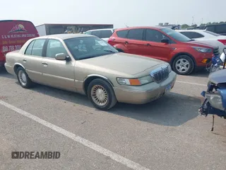 2000 Mercury Grand Marquis LS z VIN 2MEFM75W7YX729323, wystawiony jako IAAI lot #42475457 z przebiegiem 148 910 mil mil oraz . Historia ofert i sprzedaży dostępna na DreamBid. Obrazek 1.