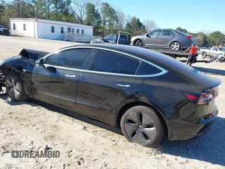 2019 Tesla Model 3 Mid Range with VIN 5YJ3E1EA2KF306286, listed as a IAAI auction lot 41699127 with 56,249 mi miles and . Bid and sale history available at DreamBid. Image 3.