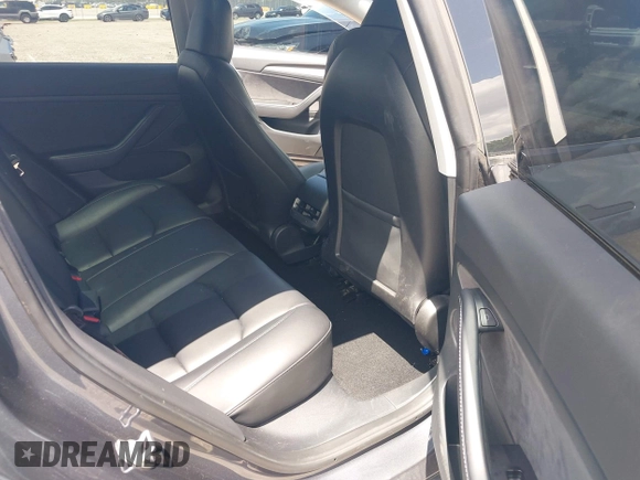 2023 Tesla Model 3 with VIN 5YJ3E1EAXPF575448, listed as a IAAI auction lot 42019288 with 33,859 mi miles and . Bid and sale history available at carsss.com. Image 8.