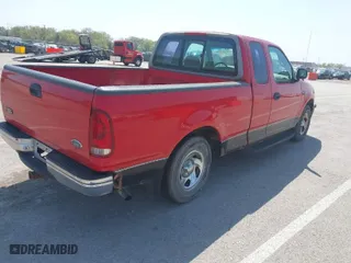 1998 Ford F-150 Standard with VIN 1FTZX1729WKB42151, listed as a IAAI auction lot 42074530 with 174,690 mi miles. Bid and sale history available at carsss.com. Image 4.