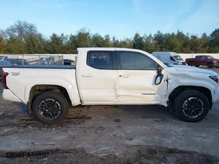 2024 Toyota Tacoma 4WD SR5 with VIN 3TMLB5JN4RM025976, listed as a IAAI auction lot 41073693 with 14,215 mi miles. Bid and sale history available at carsss.com. Image 13.
