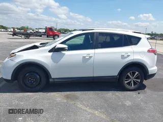 2018 Toyota RAV4 XLE with VIN 2T3WFREV9JW490324, listed as a IAAI auction lot 42298261 with 167,727 mi miles and . Bid and sale history available at DreamBid. Image 14.