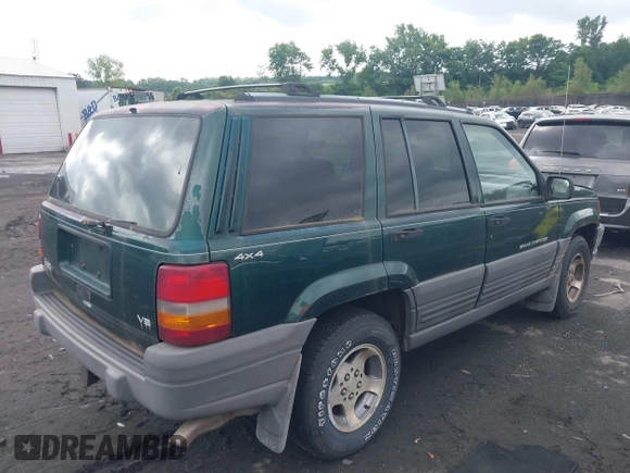 1996 Jeep Grand Cherokee with VIN 1J4EZ58Y7TC128302, listed as a IAAI auction lot 42643449 with 282,036 mi miles and . Bid and sale history available at DreamBid. Image 4.